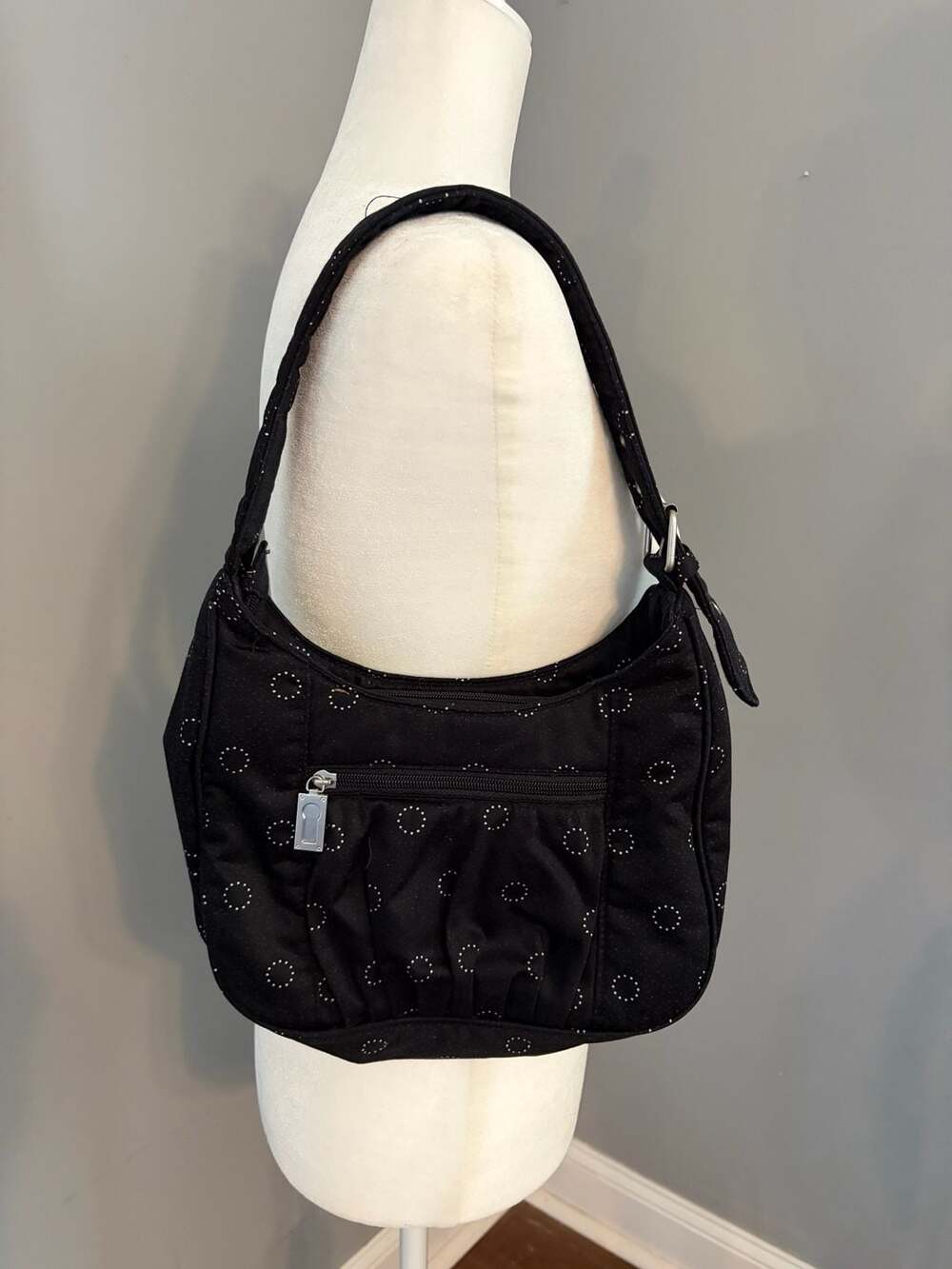 Thirty-One black hobo shoulder bag with white polka dot circles and striped inte